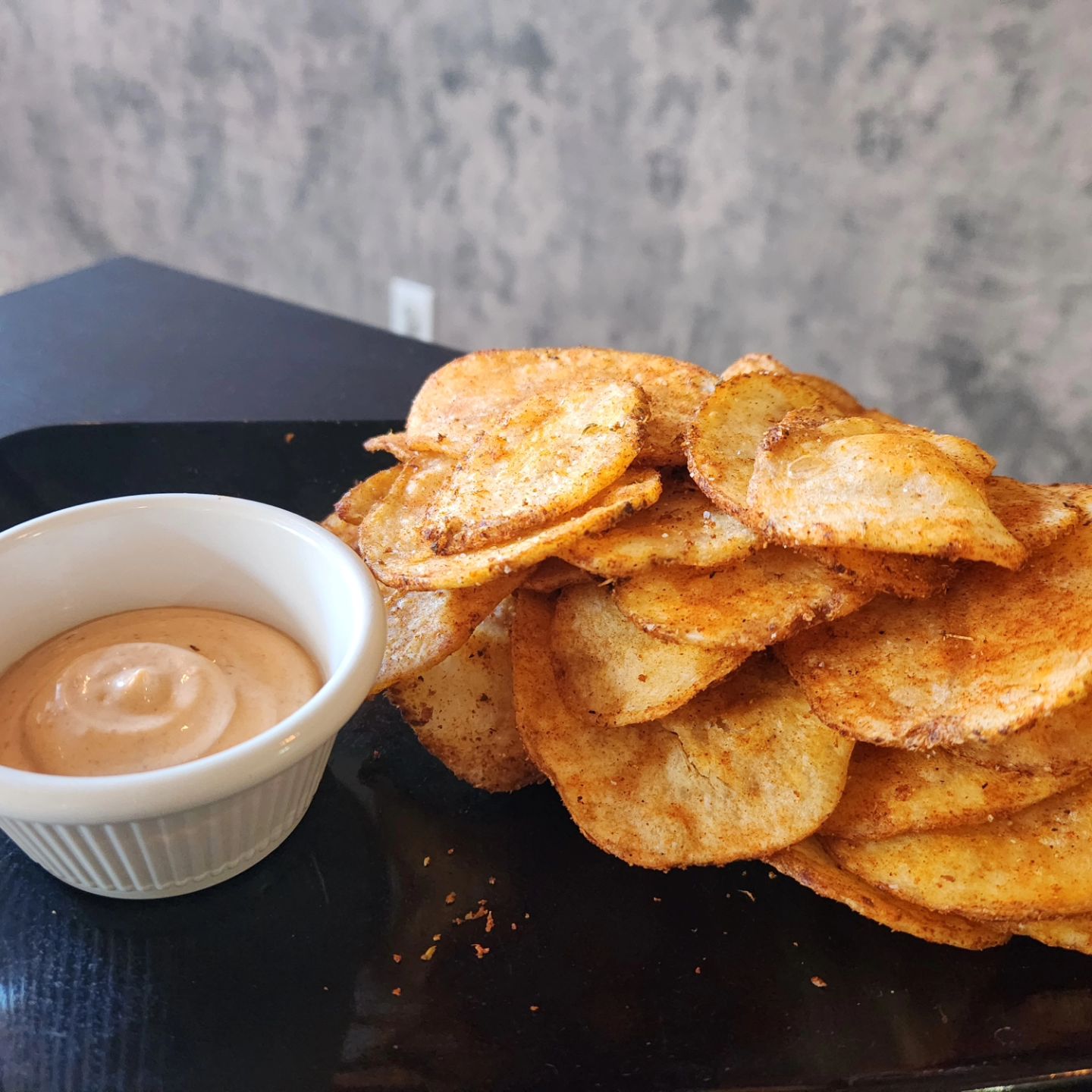 Potato Chips and dip on a plate