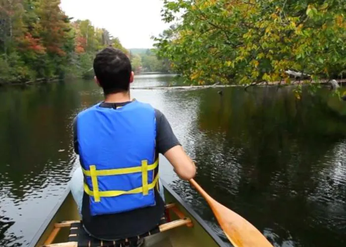 Person Paddling on Water