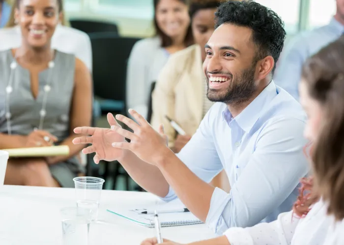 person smiling while talking