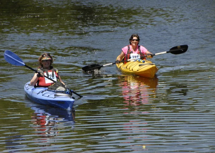 Two people kayaking on a lake