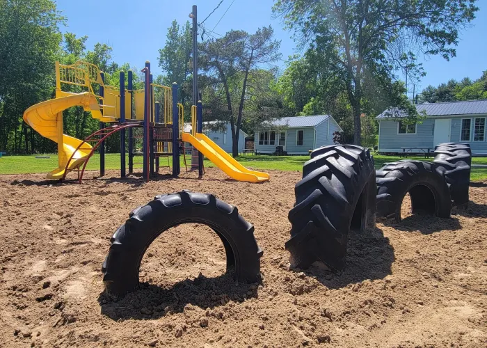 Playground in front of the cottages at Beachwood Hollow Resort on Stoco Lake in Tweed, Ontario