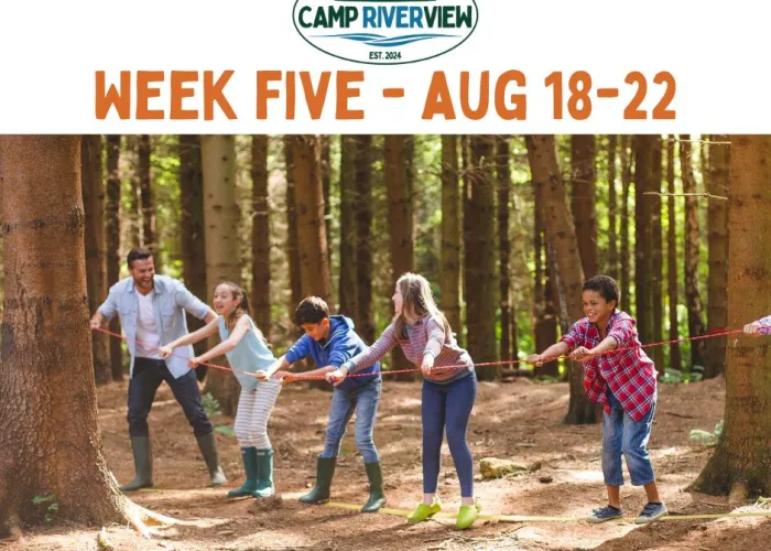 Kids and adults in the forest leaning on a piece of rope