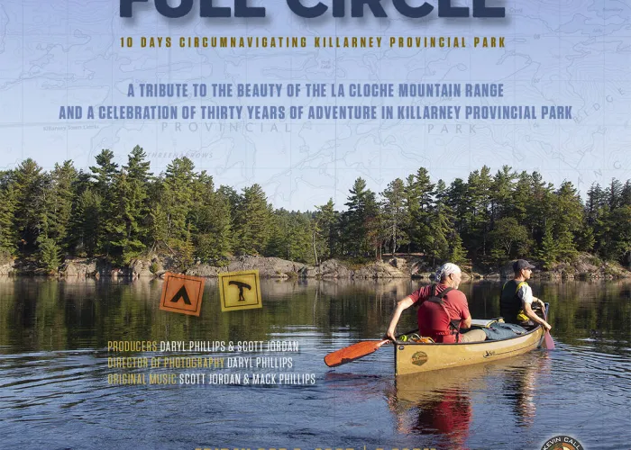 Poster for Full Circle movie screening. Image shows two people in a canoe on a lake with trees in the background.