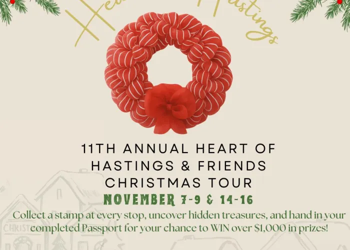Heart of Hastings Christmas Tour Poster. A red wreath with a beige background.