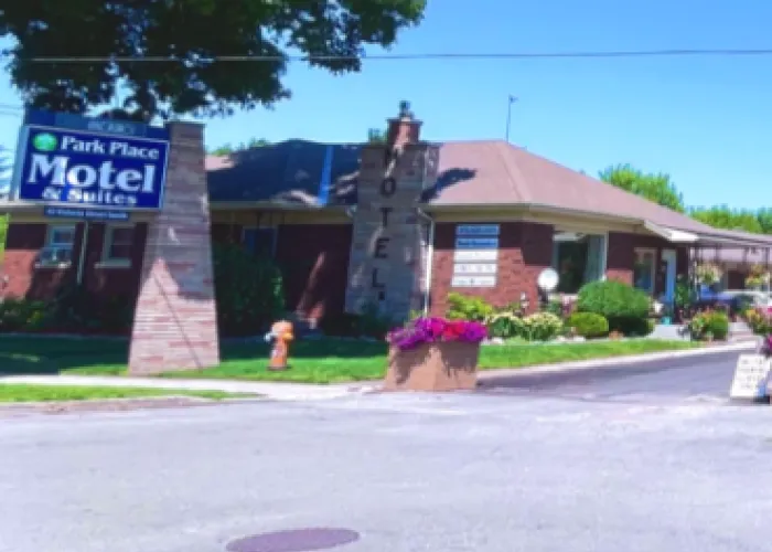 A picture of the Park Place Motel in Tweed. The image shows a blue sign and a brick motel.
