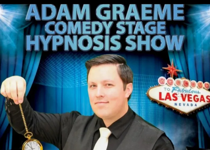 Adam Graeme holding pocket watch, las vegas sign, blue stage curtains, event name
