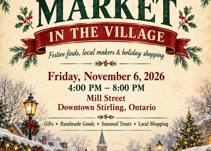 Winter scene, outdoor market stalls, people bundled up walking in centre, lights and garlands strung down the lane, clocktower, trees, and snowy sky in background, garland decorated event title and details at top of page