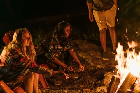 Roasting Marshmellows around the fire while camping in Hastings County, Ontario