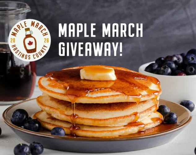 Maple March Giveaway Picture. Pancakes with the Maple March Badge and blueberries around them